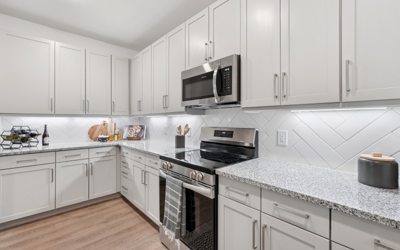 Kitchen with granite counter tops and stainless steel appliances 