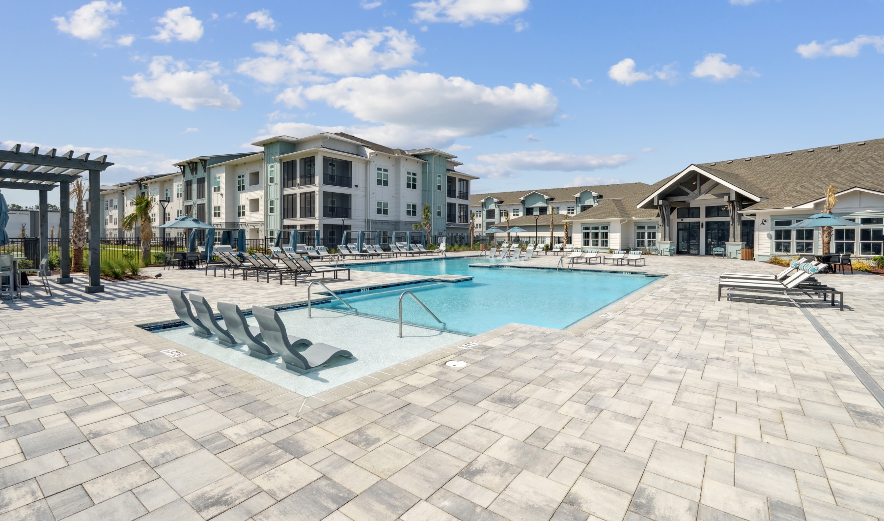 View of the pool, seating, and umbrellas