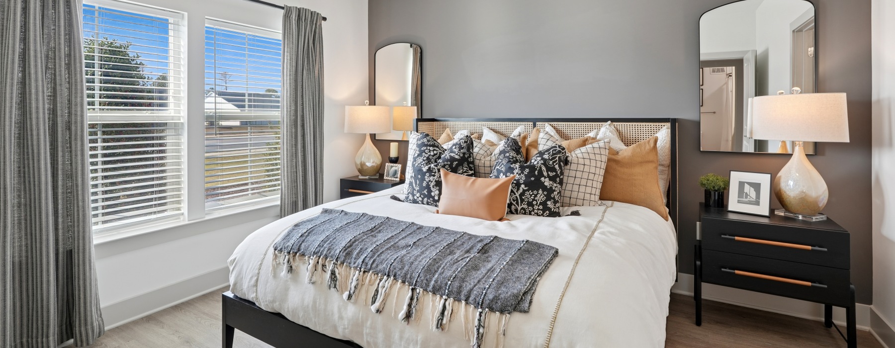 a bedroom with a bed and two nightstands